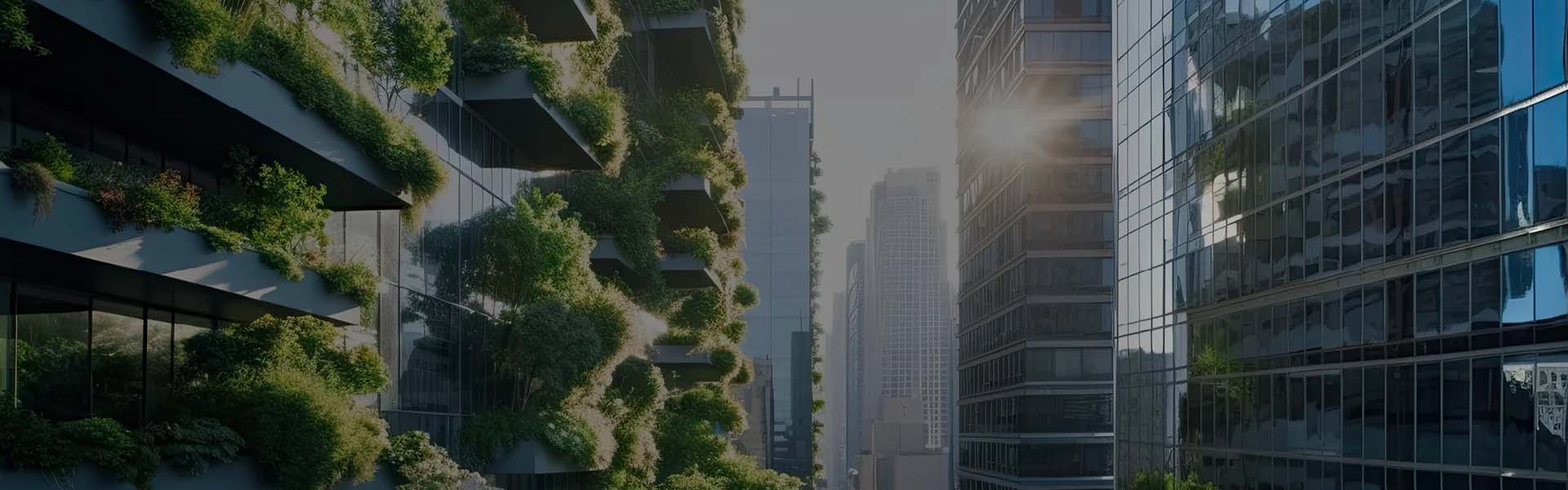 A cityscape featuring modern high-rise buildings with extensive greenery on their facades, amidst a backdrop of other skyscrapers reflecting sunlight, showcases the innovative spirit of Building Cities akin to the precision seen in MicroStation-designed campuses.
