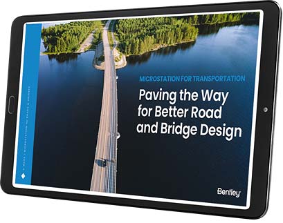 A tablet displaying an app with the text: "Paving the Way for Better Road and Bridge Design," showcases an image of a road and bridge over water, surrounded by forested areas. The app integrates MicroStation to enhance road and bridge design processes. | Bentley Systems | Infrastructure Engineering Software Company A tablet displaying an app with the text: "Paving the Way for Better Road and Bridge Design," showcases an image of a road and bridge over water, surrounded by forested areas. The app integrates MicroStation to enhance road and bridge design processes.