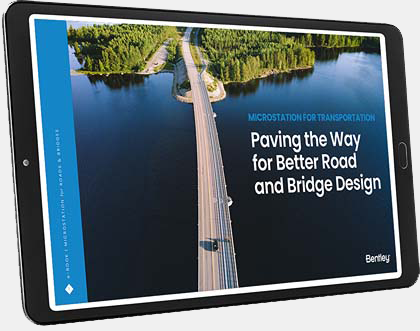 Tablet displaying a cover page with a road and bridge over water, titled "Paving the Way for Better Road and Bridge Design with MicroStation" by Bentley. | Bentley Systems | Infrastructure Engineering Software Company Tablet displaying a cover page with a road and bridge over water, titled "Paving the Way for Better Road and Bridge Design with MicroStation" by Bentley.